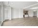 Spacious living room with hardwood floors and easy access to the kitchen area at 35609 Stableton Lane, Zephyrhills, FL 33541