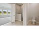 A serene bathroom boasts a glass-enclosed shower and modern fixtures, perfect for relaxation at 35617 Stableton Lane, Zephyrhills, FL 33541