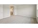 Bright bedroom with carpet, neutral walls, and an ensuite bathroom at 35617 Stableton Lane, Zephyrhills, FL 33541
