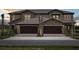 View of the exterior of a two-story townhome at 35617 Stableton Lane, Zephyrhills, FL 33541