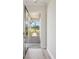 Foyer view showcases a glass front door, and a brick path leading to the new home at 35617 Stableton Lane, Zephyrhills, FL 33541