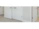 Hallway with carpet and multiple doors and white trim at 35617 Stableton Lane, Zephyrhills, FL 33541