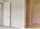 Hallway showing connections between rooms and neutral color palette at 35617 Stableton Lane, Zephyrhills, FL 33541