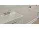 Laundry room sink with faucet and wall hookups at 35617 Stableton Lane, Zephyrhills, FL 33541
