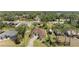 Aerial view of a single Gathering house on a wooded lot with a long driveway and RV parking at 3610 Woodbridge Ave, North Port, FL 34287