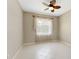 Bright bedroom featuring tile flooring and a decorative ceiling fan at 3610 Woodbridge Ave, North Port, FL 34287