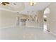 Open-concept floor plan showcasing tile flooring and views to the kitchen and living areas at 3610 Woodbridge Ave, North Port, FL 34287