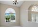 Comfortable living area with bright windows, neutral colors, and tile flooring at 3610 Woodbridge Ave, North Port, FL 34287