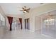 Spacious sunroom with tile floors, multiple windows, sliding glass doors, and a ceiling fan at 3610 Woodbridge Ave, North Port, FL 34287