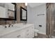 Modern bathroom featuring double sinks and a spacious shower at 3708 N 56Th St, Tampa, FL 33619