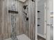 Modern bathroom shower features stylish tile accents, a niche, and sleek black fixtures at 3708 N 56Th St, Tampa, FL 33619