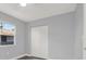 This bedroom features a window that lets in plenty of natural light and a closet with plenty of storage space at 3708 N 56Th St, Tampa, FL 33619