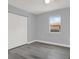 Bright bedroom features a window that lets in plenty of natural light and a closet with plenty of storage space at 3708 N 56Th St, Tampa, FL 33619
