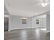 Open concept room with recessed lights and gray walls and floors with white trim at 3708 N 56Th St, Tampa, FL 33619
