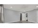 Neutral bedroom featuring a modern door and gray toned floor at 3708 N 56Th St, Tampa, FL 33619