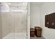 Modern shower with glass door and towel rack in the bathroom, plus wicker storage baskets at 3952 Almond Brook Blvd, Land O Lakes, FL 34638