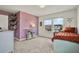 Charming bedroom with unique floral wallpaper, neutral carpet, and natural light at 3952 Almond Brook Blvd, Land O Lakes, FL 34638