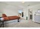 Neutral bedroom featuring a window, carpet, and storage bed at 3952 Almond Brook Blvd, Land O Lakes, FL 34638