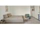 Neutral-toned Bedroom features a daybed, a cozy chair and natural light at 3952 Almond Brook Blvd, Land O Lakes, FL 34638