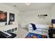 Bright bedroom featuring space-themed decor, storage drawers, and a comfortable bed at 3952 Almond Brook Blvd, Land O Lakes, FL 34638