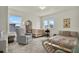 Inviting Bedroom with ample natural light, crib, rocker, and cozy decor at 3952 Almond Brook Blvd, Land O Lakes, FL 34638