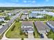 Aerial view showing a pool, playground, and community amenities at 3952 Almond Brook Blvd, Land O Lakes, FL 34638