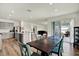 Open dining area between kitchen and patio features a dining table perfect for entertaining at 3952 Almond Brook Blvd, Land O Lakes, FL 34638