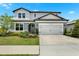Charming two-story home featuring a two-car garage and well-maintained landscaping at 3952 Almond Brook Blvd, Land O Lakes, FL 34638