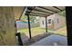 View from the covered patio looking at the shed at 39772 Meadowood Loop, Zephyrhills, FL 33542