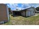Backyard featuring a covered patio at 39772 Meadowood Loop, Zephyrhills, FL 33542