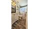 Cozy bathroom with wood-look tile and marble shower curtain at 39772 Meadowood Loop, Zephyrhills, FL 33542