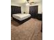 Comfortable bedroom with plush carpet and dark curtains at 39772 Meadowood Loop, Zephyrhills, FL 33542