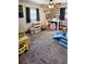 Playful bedroom with carpet and ample space for toys and activities at 39772 Meadowood Loop, Zephyrhills, FL 33542