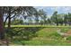 View of a golf course from the property at 39772 Meadowood Loop, Zephyrhills, FL 33542