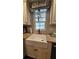 Close-up of the farmhouse sink and granite countertops at 39772 Meadowood Loop, Zephyrhills, FL 33542