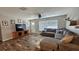 Comfortable living room with a large sectional sofa and stylish decor at 39772 Meadowood Loop, Zephyrhills, FL 33542
