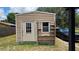 Exterior view of storage shed with shelves at 39772 Meadowood Loop, Zephyrhills, FL 33542
