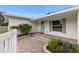 Charming entryway featuring a quaint blue door and landscaped walkway at 4709 W Fair Oaks Ave, Tampa, FL 33611