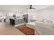 Modern kitchen and living area featuring an open floor plan, stylish decor, and updated appliances at 4709 W Fair Oaks Ave, Tampa, FL 33611
