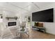 Cozy living room highlighting a fireplace, shiplap wall, and comfortable seating arrangement at 4709 W Fair Oaks Ave, Tampa, FL 33611