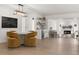 Stylish dining and living area featuring hardwood floors, modern lighting, and open floorplan at 4709 W Fair Oaks Ave, Tampa, FL 33611