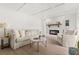 Comfortable living room features a fireplace, shiplap wall and wood flooring at 4709 W Fair Oaks Ave, Tampa, FL 33611
