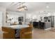 Open concept dining and kitchen area featuring modern finishes and seamless flow at 4709 W Fair Oaks Ave, Tampa, FL 33611