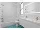 Modern bathroom with blue tile floor, featuring a tub, shower and double vanity at 500 38Th Ne Ave, St Petersburg, FL 33704