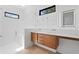 Modern bathroom with dual sinks, floating wood vanity, and a glass-enclosed shower at 500 38Th Ne Ave, St Petersburg, FL 33704