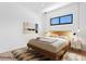 Bright bedroom featuring a wooden bed frame, stylish rug, and modern decor at 500 38Th Ne Ave, St Petersburg, FL 33704