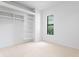 Bright bedroom featuring closet and a window at 500 38Th Ne Ave, St Petersburg, FL 33704