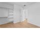 Clean bedroom featuring a modern closet with built-in shelving and wood-look floors at 500 38Th Ne Ave, St Petersburg, FL 33704