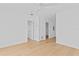 Minimalist bedroom with hardwood floors, ceiling fan, recessed lighting, and two entry doors at 500 38Th Ne Ave, St Petersburg, FL 33704