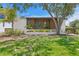 Inviting modern home with wood accents, mature trees, and lush landscaping at 500 38Th Ne Ave, St Petersburg, FL 33704